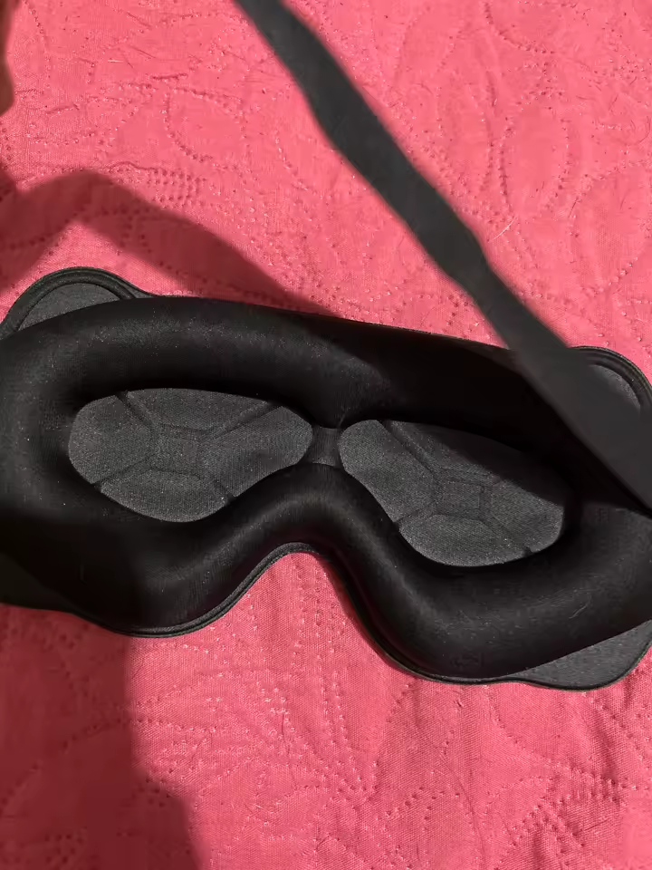 Close-up customer photo of the black mask's padded eye cavities